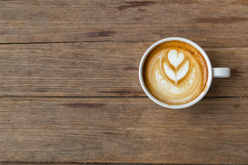 cup of coffee on wood table blackground