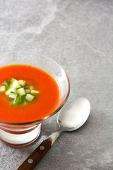 Traditional Spanish cold gazpacho soup on gray stone.
