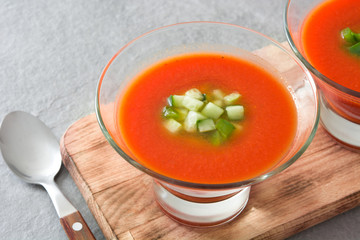 Traditional Spanish cold gazpacho soup on gray stone.
