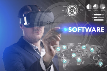 Business, Technology, Internet and network concept. Young businessman working in virtual reality glasses sees the inscription: Software
