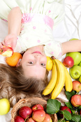 small happy girl eating exotic fruit or summer background