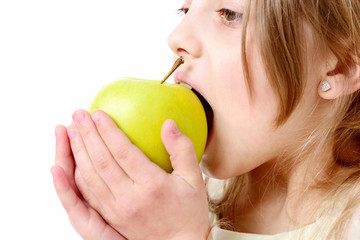 cute happy girl eating green apple isolated on white