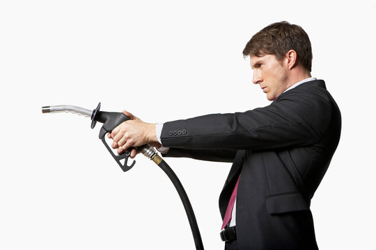 Man holding petrol pump like gun