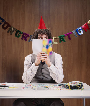 Businessman reading birthday card