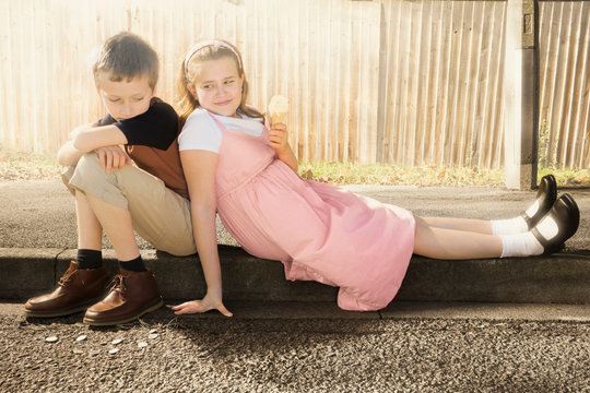 Siblings together in the street