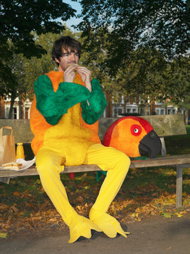 Man dressed in parrot suit