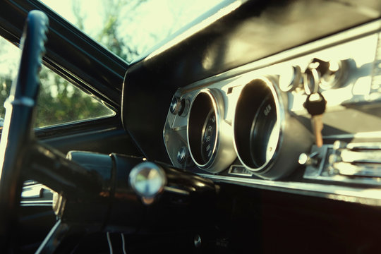 Vintage Cadillac dashboard in sunset