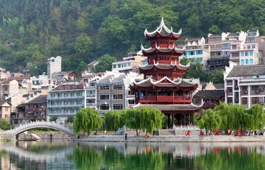 Tuinposter Beautiful pagoda in Zhenyuan Ancient Town on Wuyang river in Guizhou Province, China © Zzvet