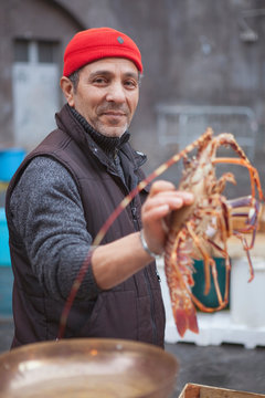 fisherman presenting lobster