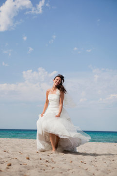 bride walking on beach