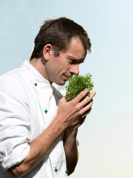Chef smelling herbs