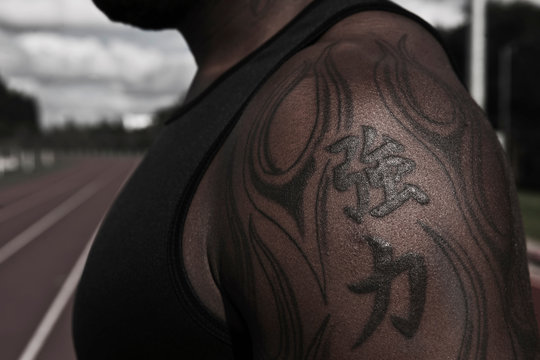 Tattoo on arm of male athlete