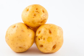 Yellow potato (Solanum phureja) isolated in white background