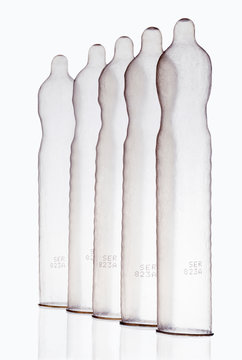 Inflated condoms standing in row