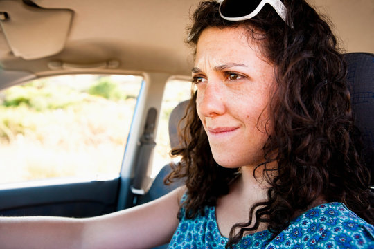 Frustrated Woman Driving Car