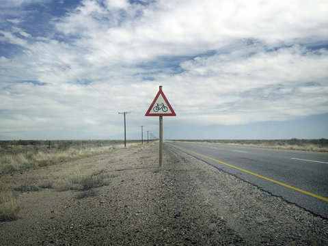 Bicycle sign on empty rural road