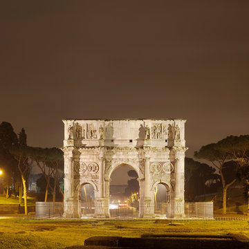 Arch of Constantine lit up at night