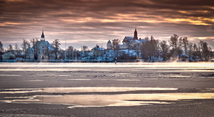 Still lakes in snowy landscape