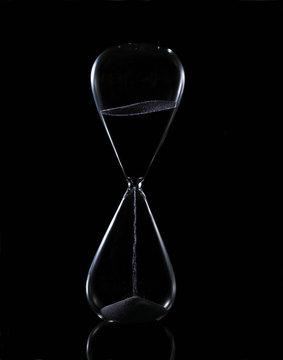 Hour glass on black background