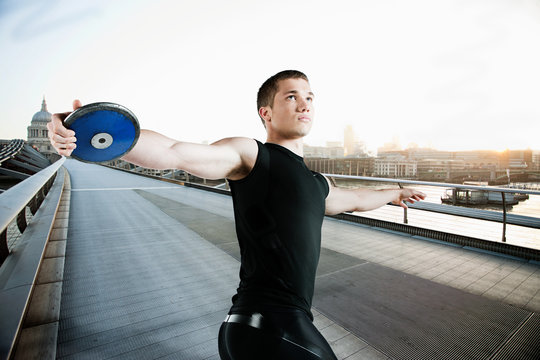 Discus thrower on Millennium Bridge, London, England