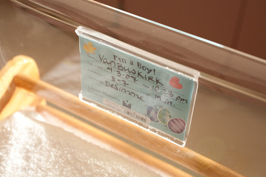 Hospital crib with label for baby boy