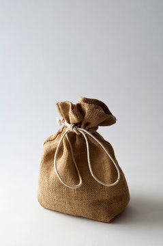 Brown sack tied with string, studio shot
