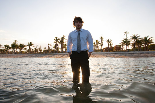 Businessman standing in sea