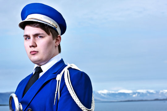 Portrait of young man wearing marching band uniform