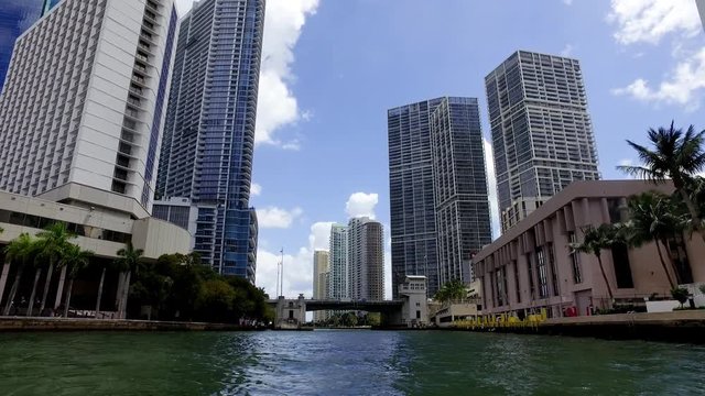 Miami Fl Traveling By Boat Through River Looking at City Center Skyline Hotels, Condos, and Apartment Buildings