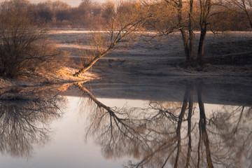 View to the Church of the Intercession of the Holy Virgin on the Nerl River in sunlight.