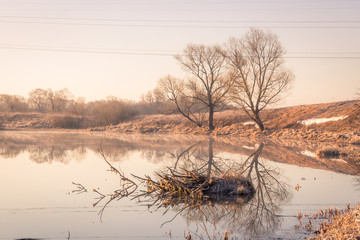 View to the Church of the Intercession of the Holy Virgin on the Nerl River in sunlight.