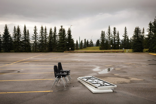Chairs and tables left in a parking lot
