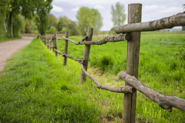 Old village fence along a country road.