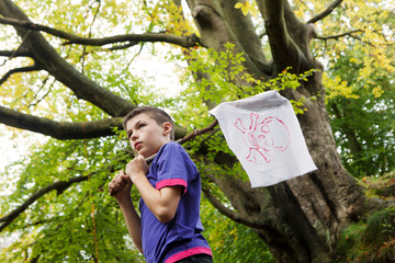 Boy holding a pirate flag