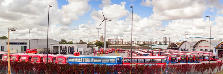 Foto op Plexiglas Famous red buses, one of garages in London, United Kingdom © Filip