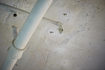 sprinkler system in the ceiling of the factory building. The old white ceiling