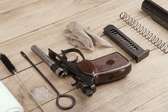 Separate parts of pistol and cleaning kit