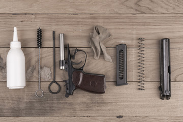 Separate parts of pistol and cleaning kit