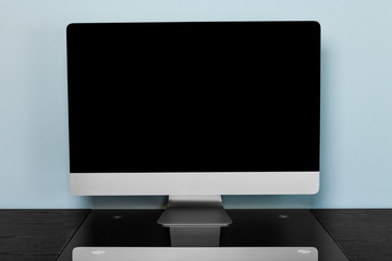 Fototapeta premium computer on a black wooden table in an office