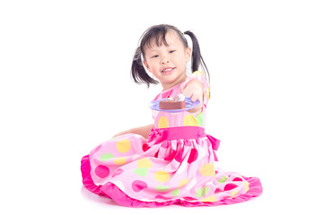 Little asian girl holding plastic cake over white