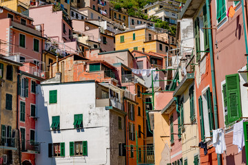 Fototapeta na wymiar View of the colorful city of Riomaggiore in the gulf of the five lands in Italy