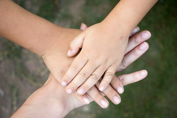 Background of hands of asian female adult and two kids group together for support