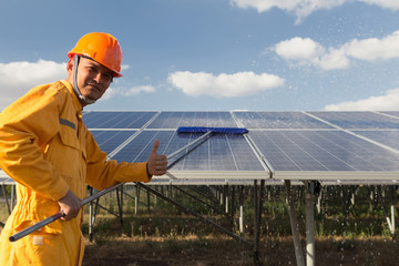 Technicians are cleaning solar panel.