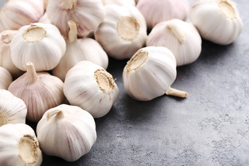 Garlic on the grey wooden table