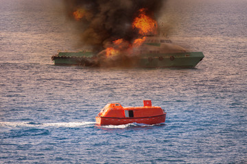 rescue boat performed demobilization passenger from supply boat because fire or worst case, Marine...
