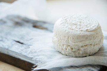 Cottage cheese with Mandarin in the plate. Dessert for Breakfast. Black wooden background