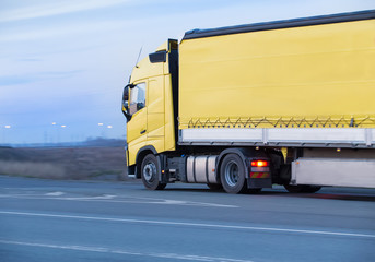 Truck move in evening on highway