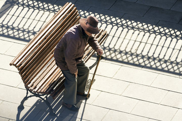 senior man sitting on a bench 