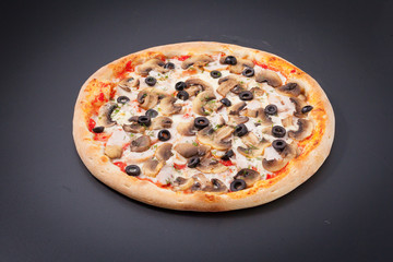 Pizza with mushrooms and olives on a chalkboard