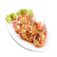 fried shrimp with curry in a white plate.